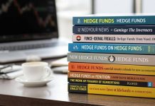 A stack of financial books on hedge funds.