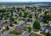 Suburban neighborhood with single-family homes and greenery.