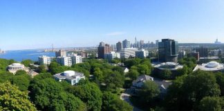 Greenwich, Connecticut skyline with modern buildings and greenery.