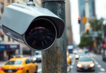 Traffic camera overlooking a busy New York City street.