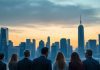 City skyline at dusk with professionals discussing finance.