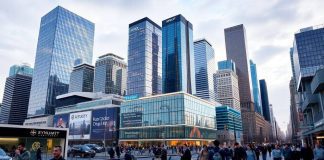 City skyline with financial buildings and busy streets.