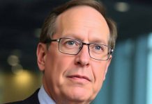 Larry Fink in a corporate office, focused and professional.